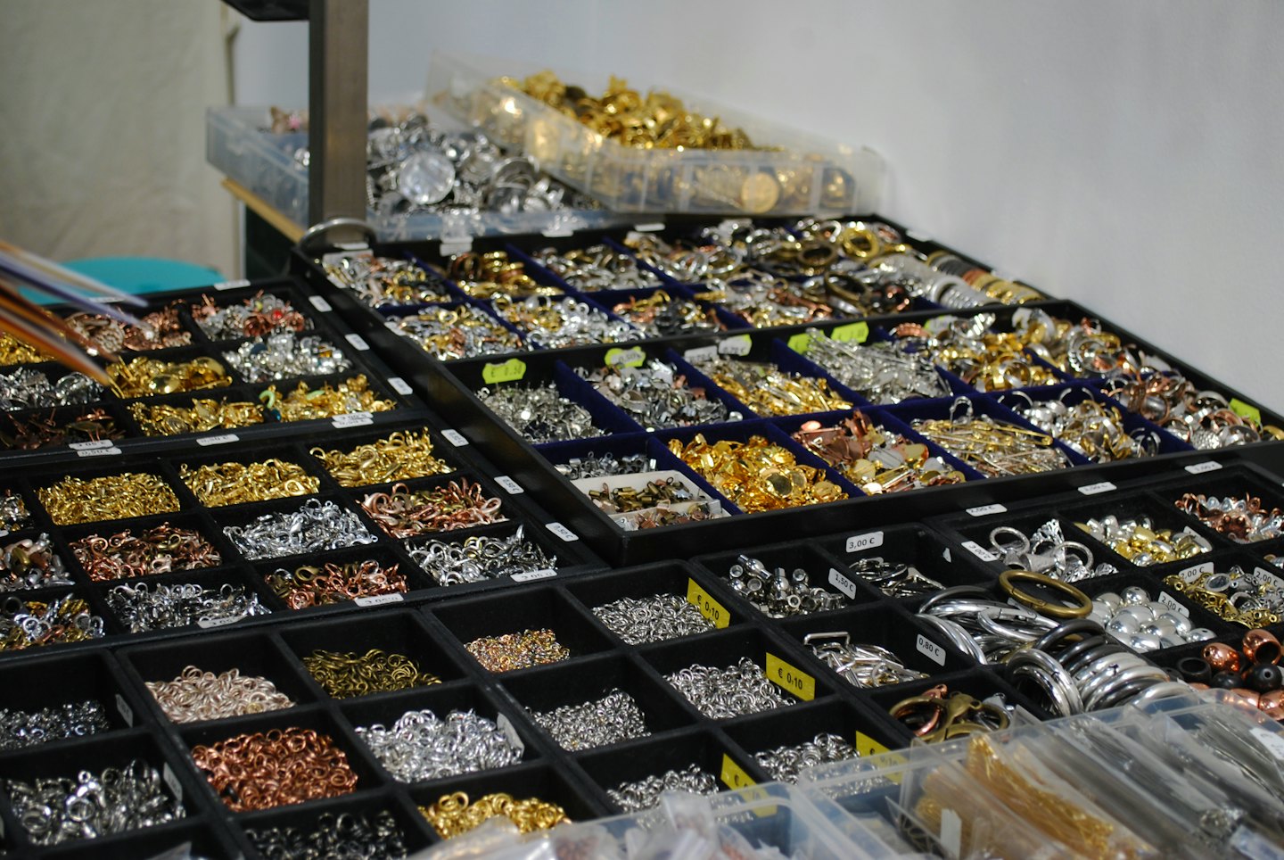 Table of jewelry components and findings sorted by metal type.